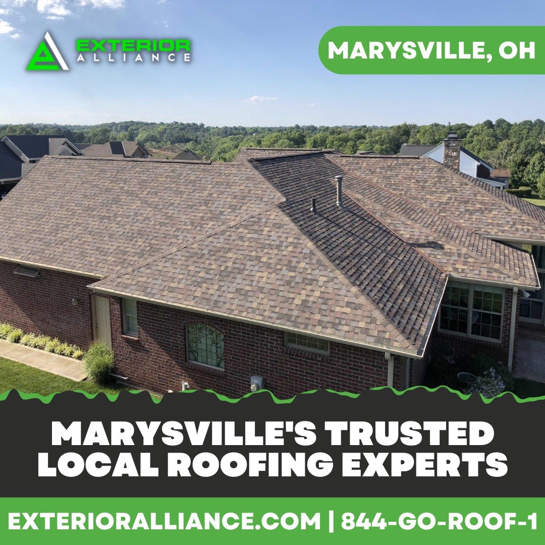 Aerial view of a brick house with a newly installed roof and an advertisement for a local roofing service in Marysville, OH.