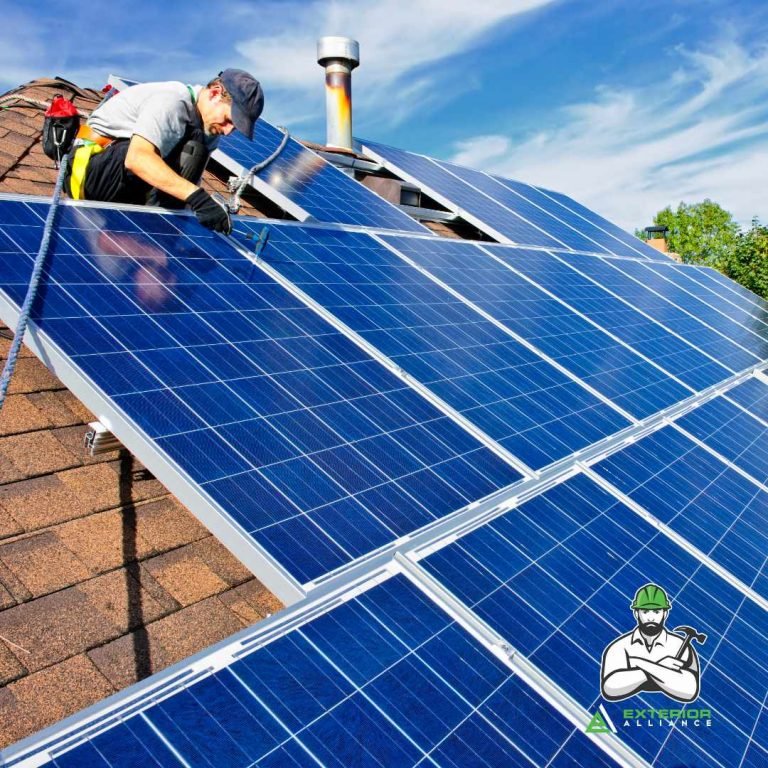 A technician is installing or maintaining large solar panels on the roof of a house.