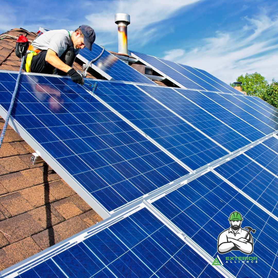 A technician is installing or maintaining large solar panels on the roof of a house.