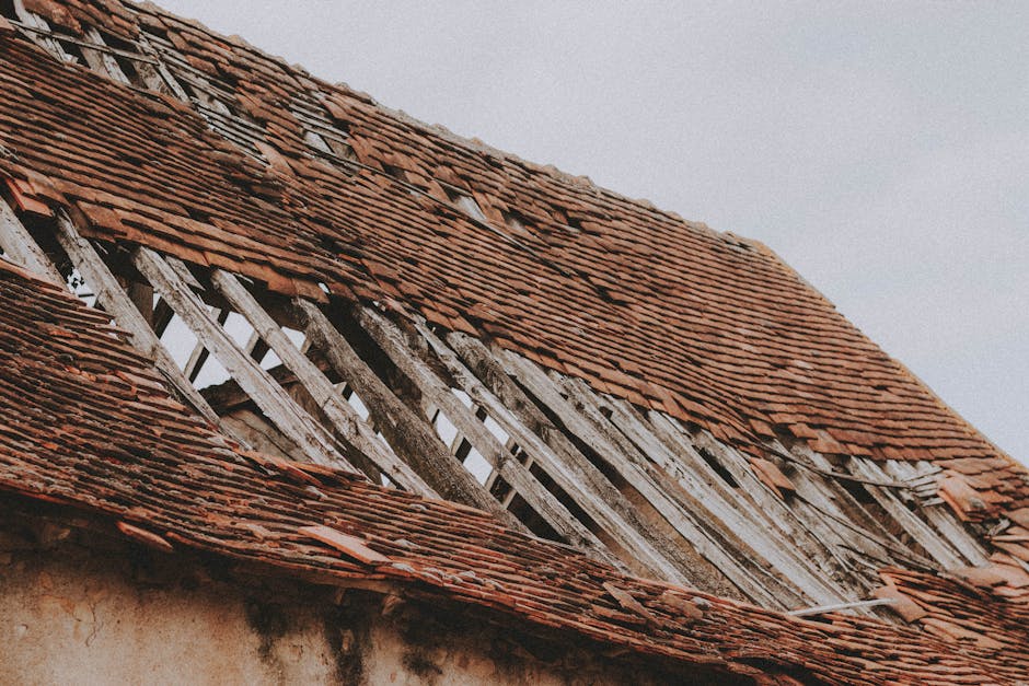 damaged roof with missing shingles and visible wear - top 10 roofing companies in columbus ohio damaged roof with missing shingles and visible wear - top 10 roofing companies in columbus ohio