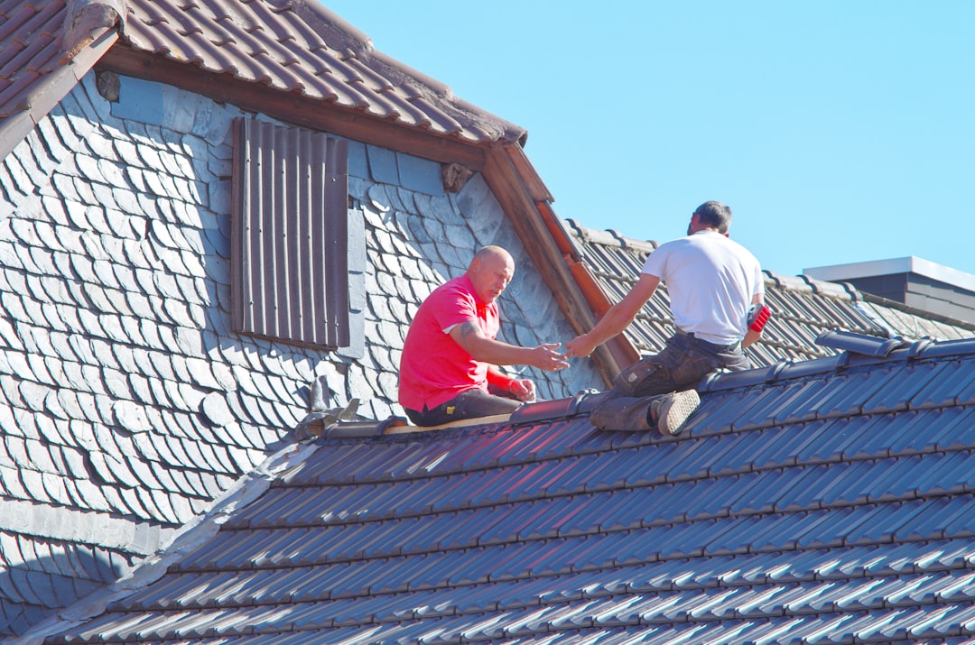 professional roofing team working safely on a residential roof - dublin ohio roofing