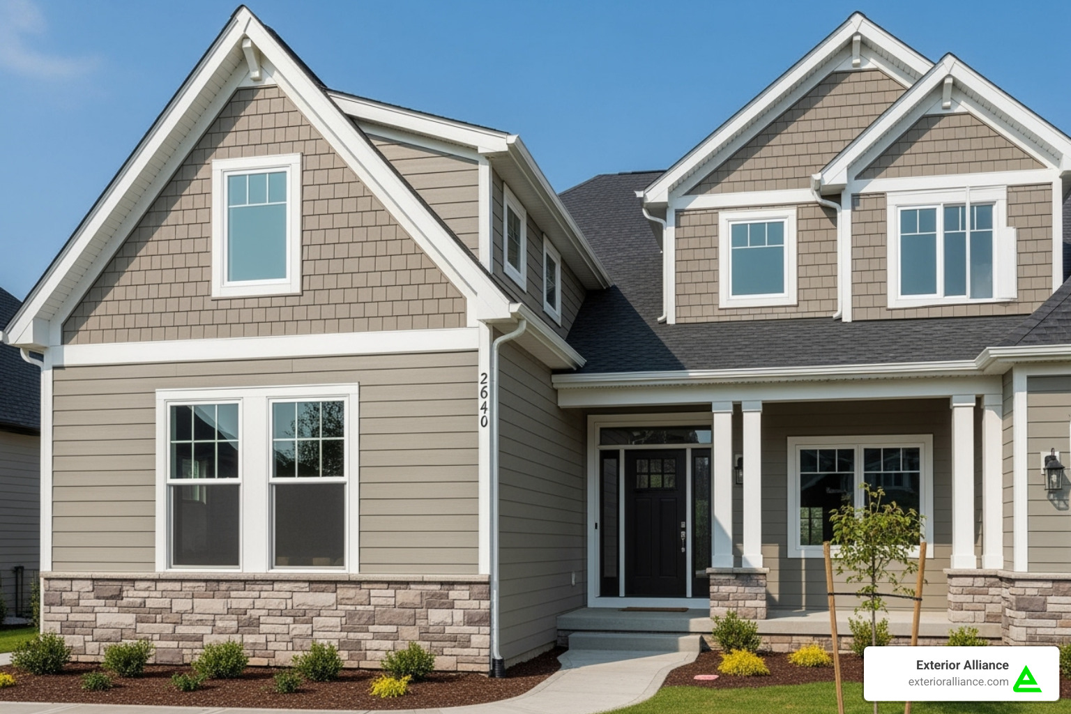 Image of a house showcasing a combination of James Hardie lap siding and shingle siding with trim details - James Hardie siding Image of a house showcasing a combination of James Hardie lap siding and shingle siding with trim details - James Hardie siding